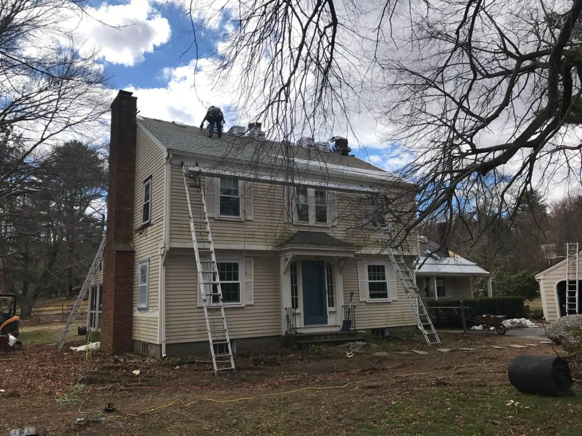 Roof replacement project on two-story residential home in Southern New Hampshire by McCarthy Exteriors